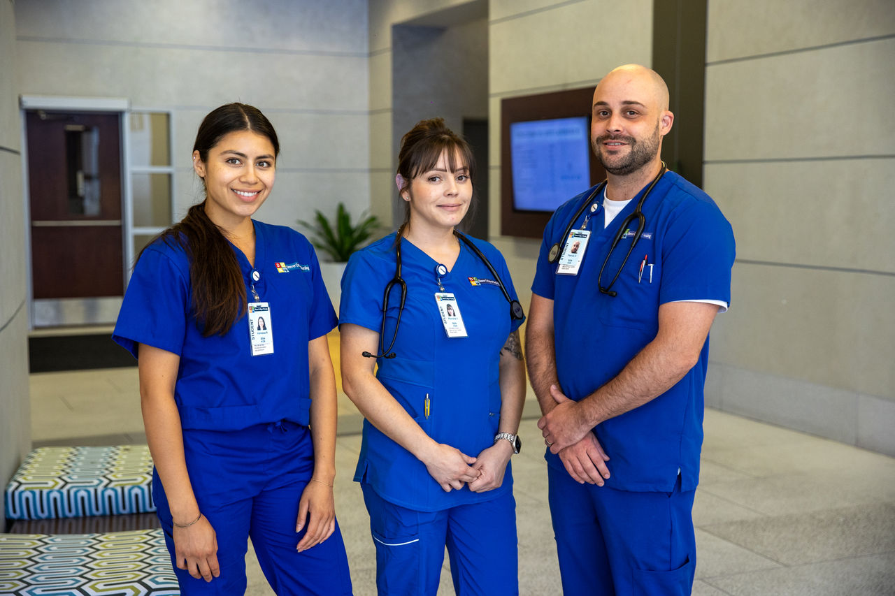 Medical professionals in blue scrubs indoors