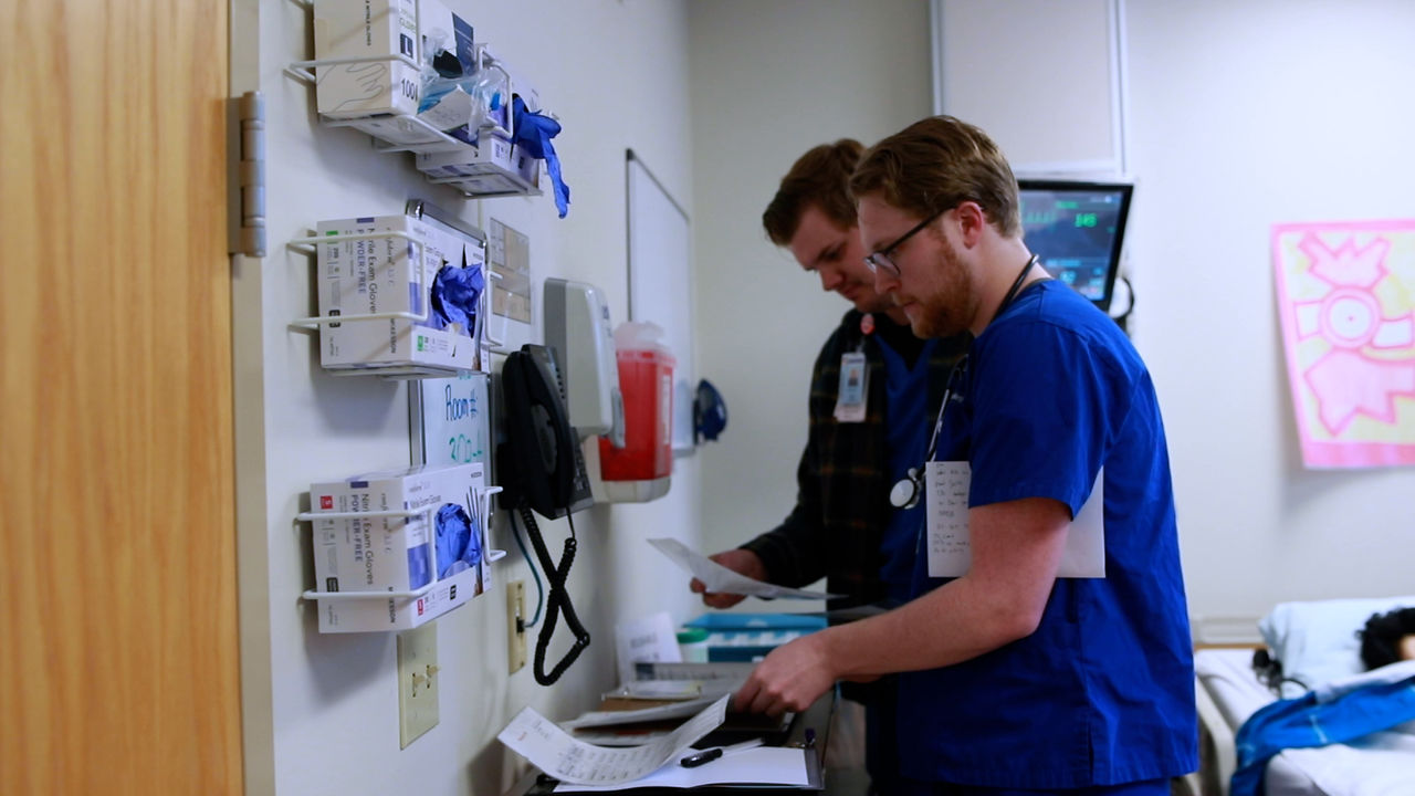 Healthcare professionals reviewing patient documents in hospital