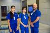 Medical professionals in blue scrubs indoors