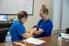 Nursing students practice blood pressure measurement